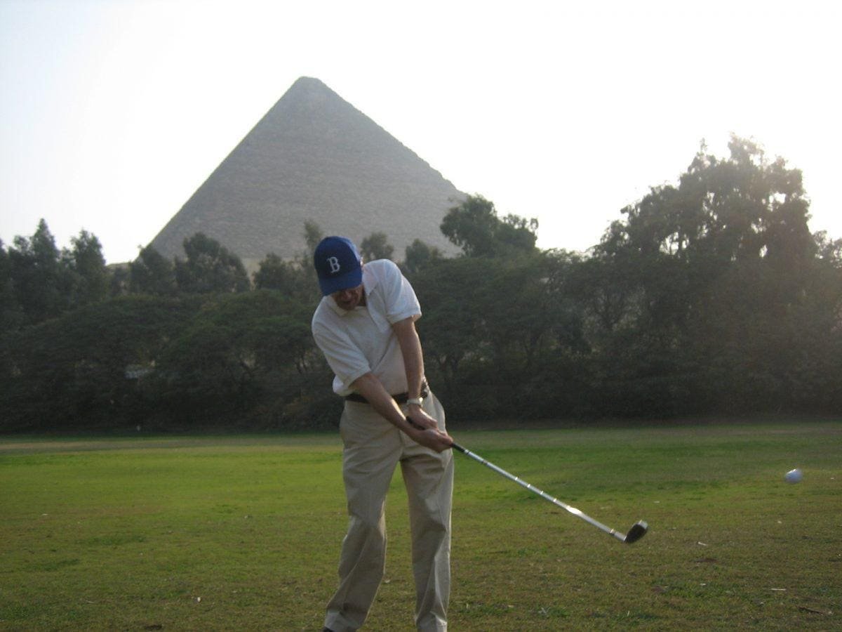 Golfer at the Giza pyramids